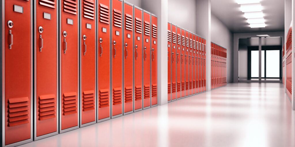 High school lobby with red color lockers, perspective view. Fitness Gym, sports club hallway.